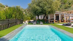 a swimming pool in the backyard of a house at Casa Corazón 44 Torrox by Ruralidays in Torrox