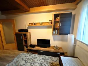 a bedroom with a desk with a laptop computer on it at Apartment Gina in Stall