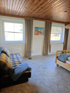 a bedroom with a bed and two windows at Apartment Gina in Stall