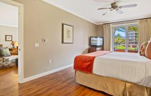 a bedroom with a bed and a window at Honua Kai Konea 204 in Lahaina +47 photos
