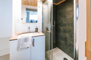 a bathroom with a sink and a shower at Tiny Seaside - Kegnæs in Østerby +46 photos