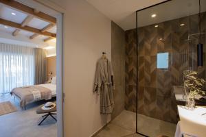 a bathroom with a shower and a bedroom at Trioda Kazdağları in Ayvacık +13 photos