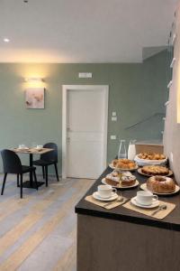 a counter with some food on top of it at Il Ritrovo Rooms in Petralia Sottana