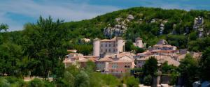 a town on a hill with a castle on it at Les Combes Claires in Saint-Julien-Labrousse +38 photos
