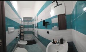 a bathroom with a white sink and a toilet at Il Viandante in Catanzaro