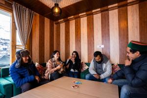 a group of people sitting on a couch in a room at PACK Sissu in Sissu +41 photos