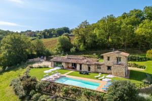 an estate with a swimming pool and a house at Villa Alessandra in Todi