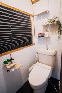 a bathroom with a white toilet and a sink at Nagoya kiyosu温もりの宿貸切一軒家駅近3分 in Nishi-biwajima +36 photos