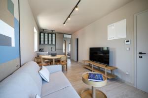 a living room with a couch and a table at Villa Vita Mare in Preko