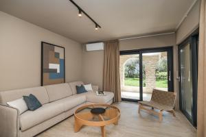 a living room with a couch and a table at Villa Vita Mare in Preko