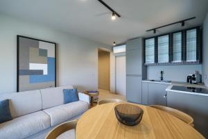 a living room with a couch and a wooden table at Villa Vita Mare in Preko +53 photos