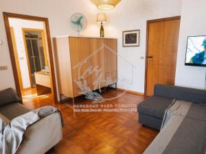 a living room with two couches and a table at CasAmare in Francavilla al Mare