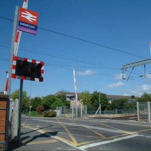 an intersection with a traffic light on a street at Bright 2-Bed Flat - 1 min to Enfield Lock Station in Enfield Lock