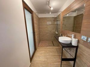 a bathroom with a sink and a mirror at Anchor Boutique- Clisura Dunării in Liborajdea +12 photos