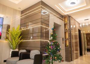 a christmas tree in the lobby of a hotel at Orchid - Bliss Hotels in Lagos
