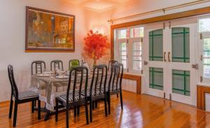 a dining room with a table and chairs at Gaash Cottages in Buna Palang