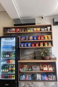 a refrigerator filled with lots of food and drinks at Hotel Almeida in Montes Claros +12 photos