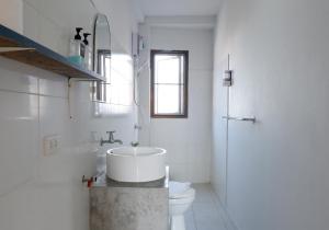 a white bathroom with a sink and a toilet at Three Monkeys Mae Nam beach in Mae Nam +37 photos