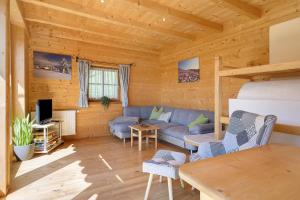 a living room with a couch and a table at Ferienhaus Schwarzenbach in San Genesio Atesino