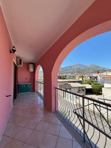 a balcony with a view of the mountains at Appartamento Rosa in Orosei