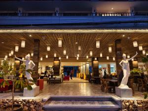 two statues of women in the lobby of a building at Wild Orchid Krabi in Ao Nam Mao +127 photos