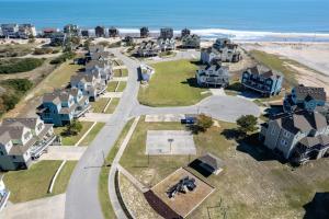 an aerial view of a beach with houses and the ocean at CAC-15B - Pollock in Buxton +40 photos