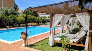 a resort with a hammock and a swimming pool at La Cañota 2-Floors King Rooms Adults Only in Talara +62 photos
