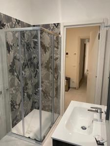 a bathroom with a shower and a sink at Kennedy rooms in Isernia
