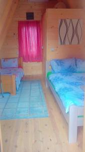 a room with two beds and a window at PROKLETIJE COTAGESEe in Plav +45 photos