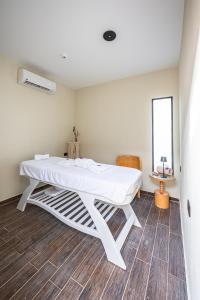 a room with a white table in a room at Sam's Story Boutique Hotel in Cairo