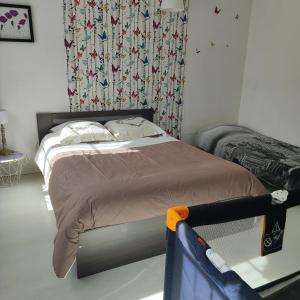 a bedroom with a large bed with a canopy at Gite pour 6 ou chambre pour 2 à FORMIGNY in Formigny