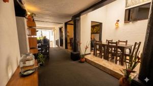 a room with a table and a dining room at Hotel Premium Real in Medellín