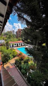a view of a resort with a swimming pool at Hotel Premium Real in Medellín