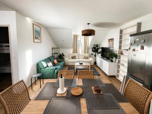 a living room with a couch and a table at Appartement St denis in Saint-Denis