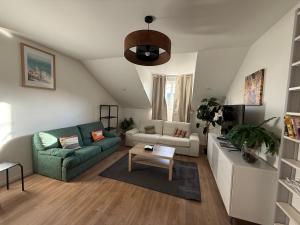a living room with a couch and a table at Appartement St denis in Saint-Denis