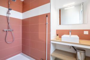 a bathroom with a shower and a sink at Maison neuve pmr proche plage in Concarneau +17 photos