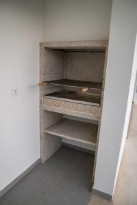 a walk in closet with a shelf in a room at Casa do Pôr do Sol in Macedo de Cavaleiros +6 photos