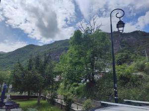 a street light with a view of a mountain at Barruera duplex 2 bedrooms heating in Barruera