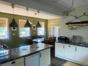 a kitchen with a counter and a dining room at 4 Bed in Derrylin oc-k35059 in Derrylin +15 photos