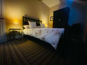 a bedroom with a bed with white sheets and pillows at 4 Bed in Derrylin oc-k35059 in Derrylin