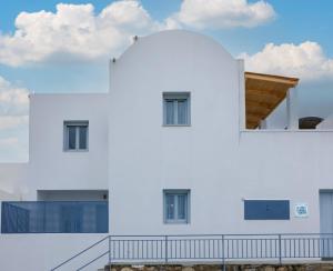 a white building with a sky in the background at Begi Luxury Villas in Karterados