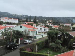 a view of a town with cars and houses at Vivenda "Porto de Abrigo" in Biscoitos
