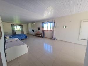 a large room with a bed and a table at Casa completa, Praia e Rio in Extremóz +15 photos