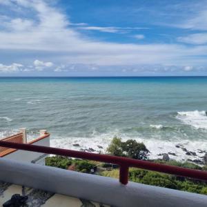 a view of the ocean from a balcony at Favola Marina in Scalea