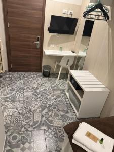 a room with a desk and a door and a floor at Hotel Vintage Milano Centrale in Milan +30 photos