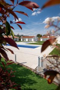 a view of a swimming pool in a yard at Casa da Pegada in Macedo de Cavaleiros