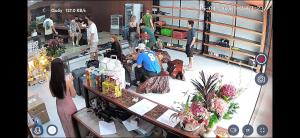 an overhead view of a store with people standing around a counter at Savor Hostel-Motorbike Rental-Tour in Làng Lap