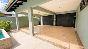 an empty porch of a house with a pool at Casa Premium no Centro - Passos do Alles Park in Pomerode