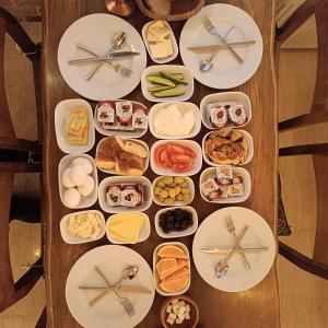 a table with plates of food on it at walkabout apart in Istanbul