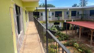 a balcony of a building with a fence at Hotel centro de Pedernales in Pedernales +1 photo